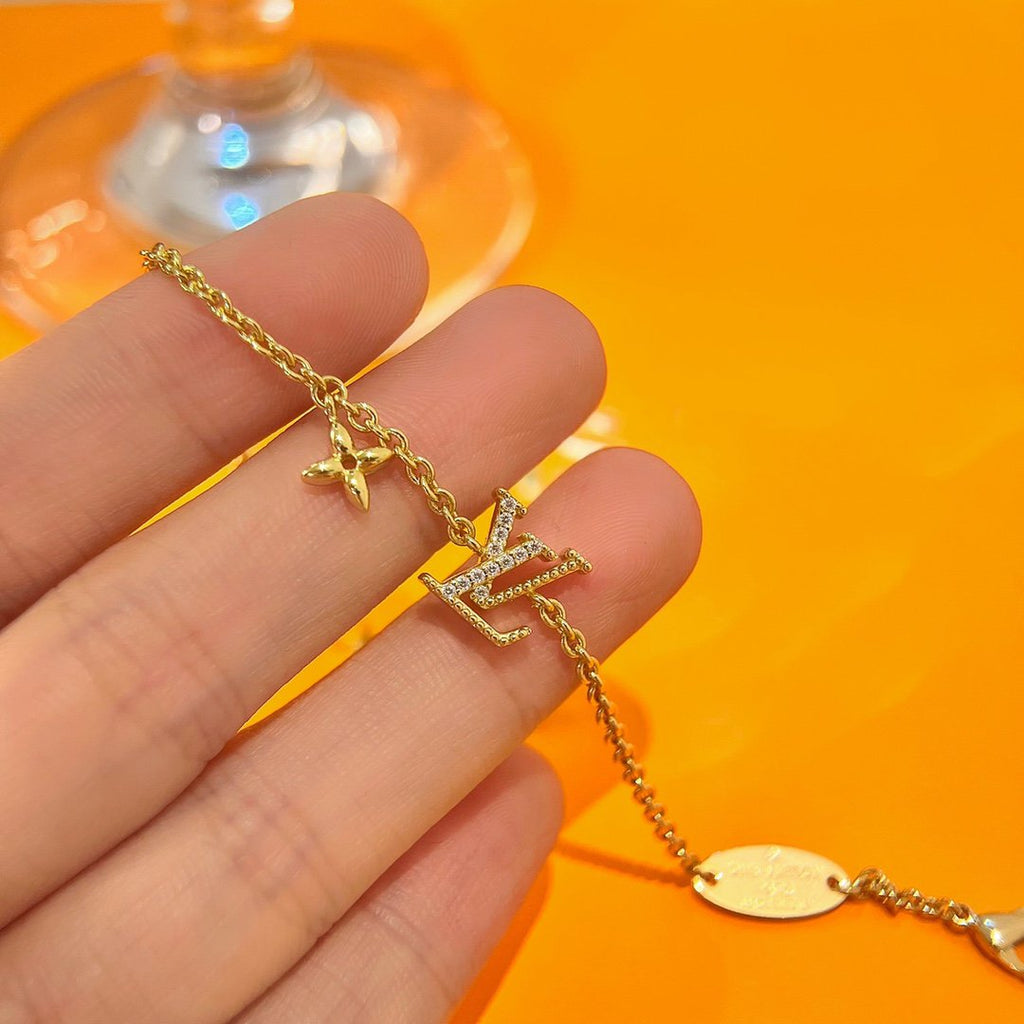 GlowLOGO STAR MOTIF GOLD BRACELET