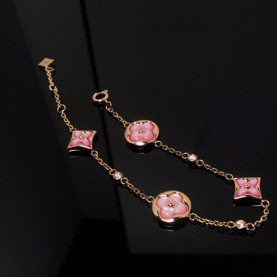 GlowSTAR AND SUN 4 MOTIF PINK MOP PINK GOLD BRACELET