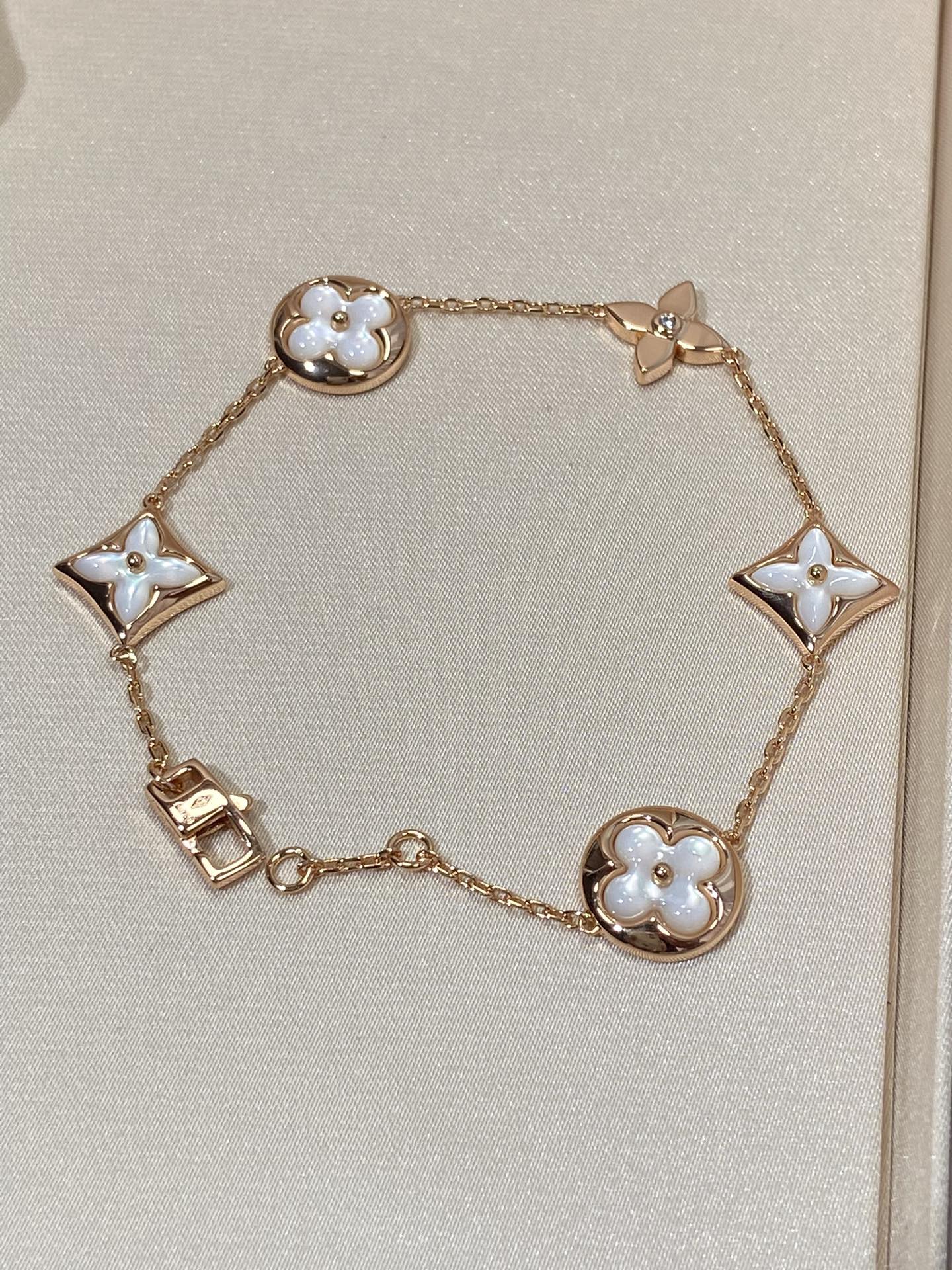 GlowSTAR AND SUN 5 MOTIF MOP PINK GOLD BRACELET