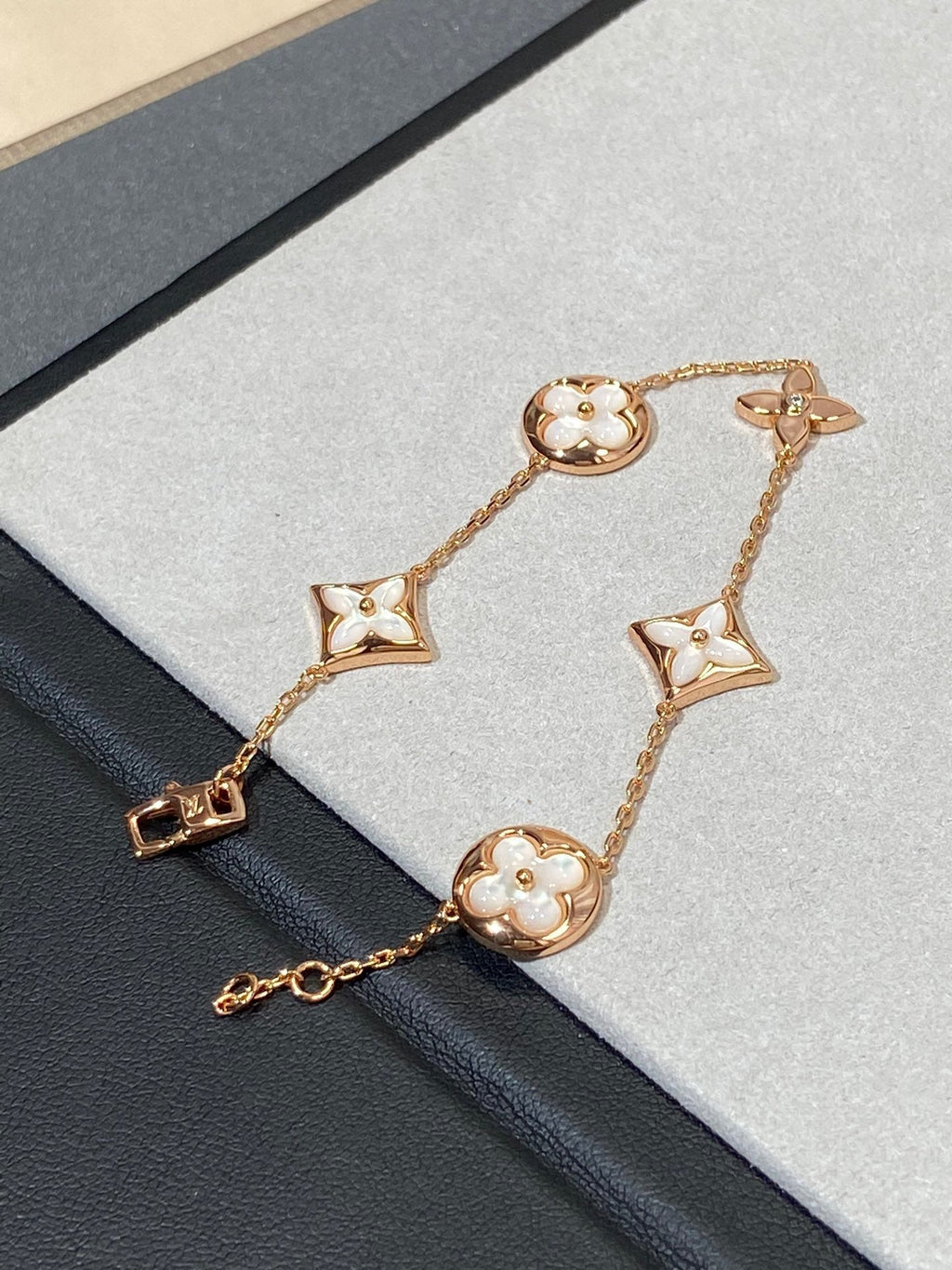 GlowSTAR AND SUN 5 MOTIF MOP PINK GOLD BRACELET