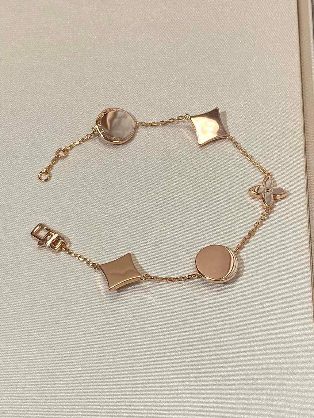 GlowSTAR AND SUN 5 MOTIF MOP PINK GOLD BRACELET