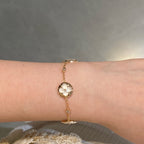 GlowSTAR AND SUN 4 MOTIF WHITE MOP PINK GOLD BRACELET