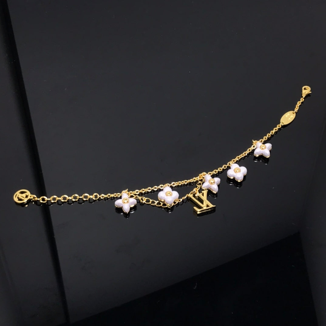 GlowLOGO 6 MOTIF STAR AND SUN GOLD BRACELET